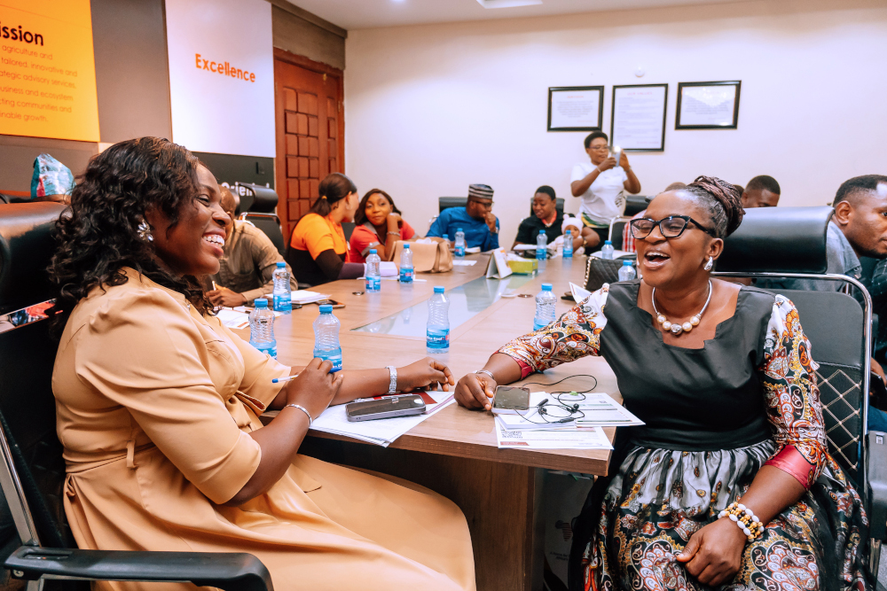 Participants connecting and sharing ideas around a table at an AFC gathering